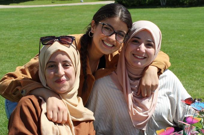 Three girls outside smiling