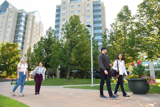 Campus scenic with students walking on pathway