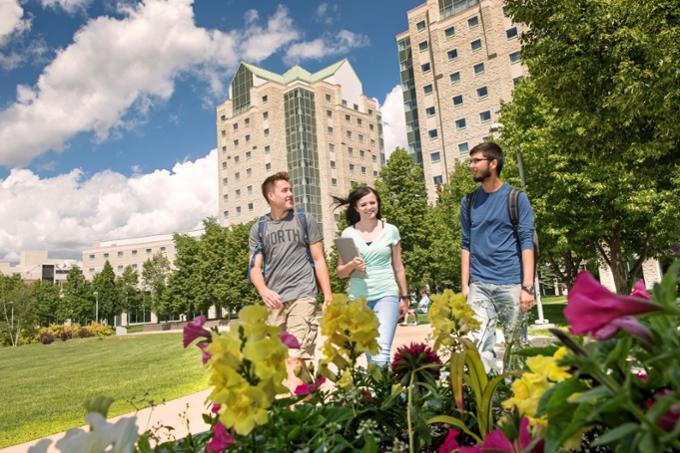 Students walking on academic green