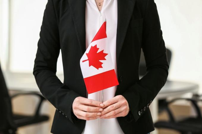 Woman holding Canadian flag