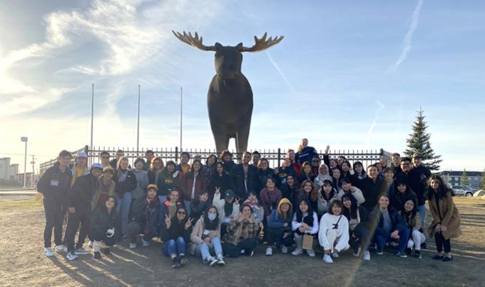 Exchange students with Mac the Moose