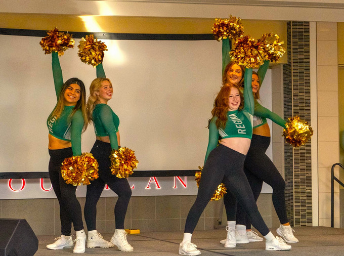 Four cheerleaders posing