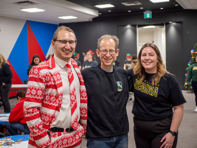 Two people pose with President Keshen